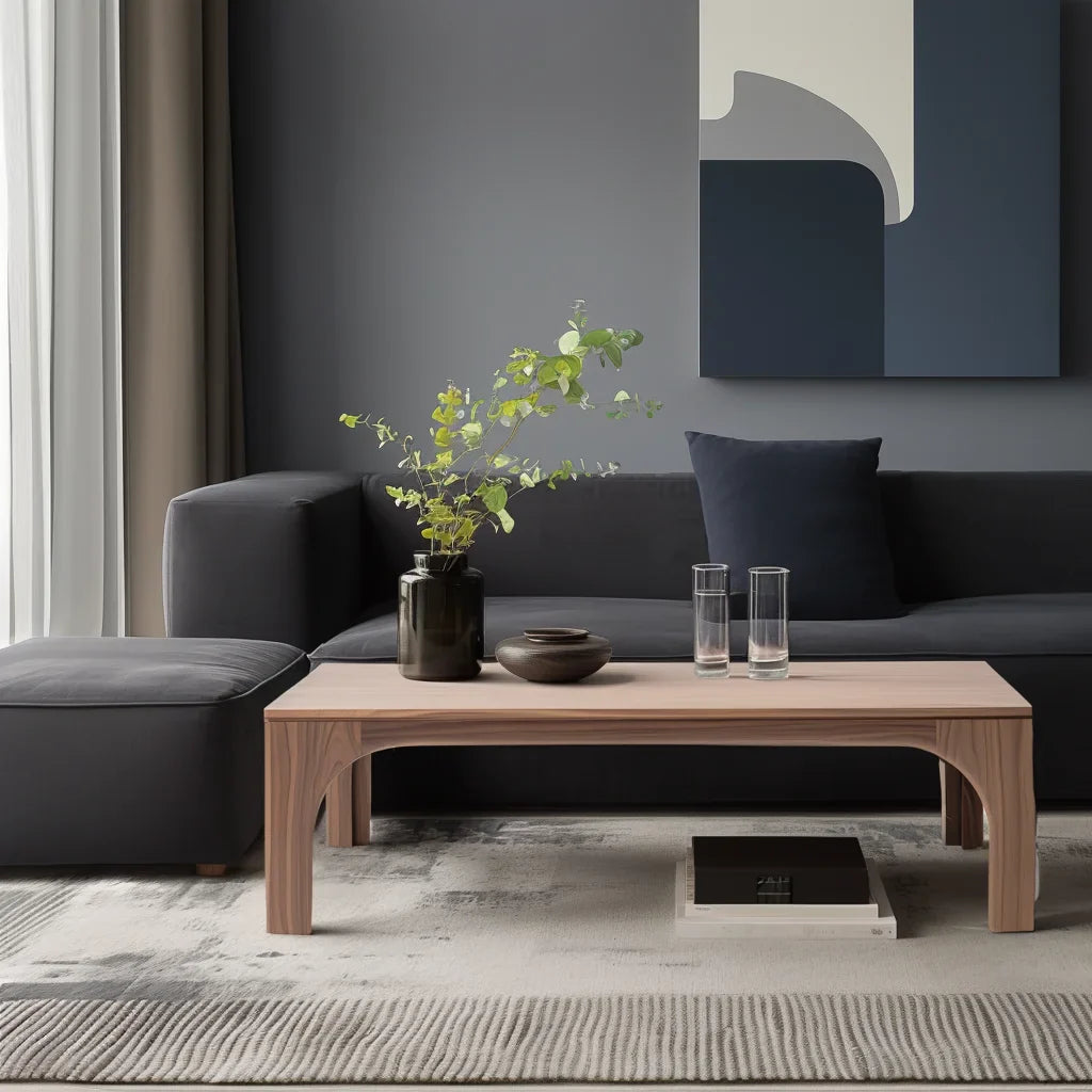 Arched leg coffee table styled in soft living room setting with sculptural presence and clean layout