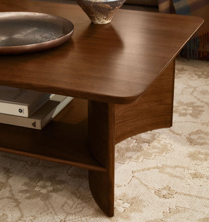 Contemporary Curved Coffee Table with rich wood finish and lower shelf