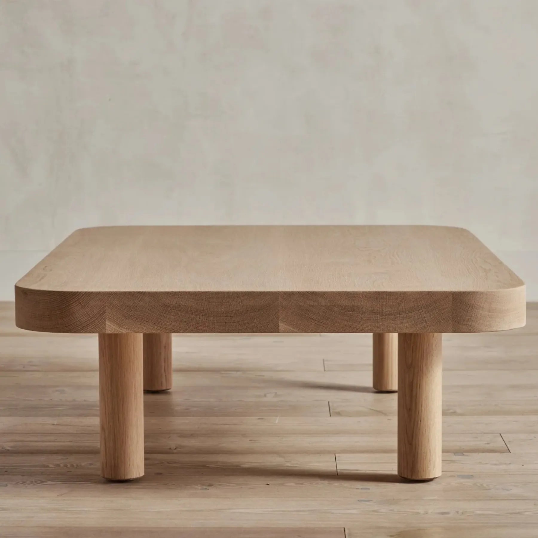 Contemporary Low Profile Coffee Table with rounded edges and sturdy cylindrical legs