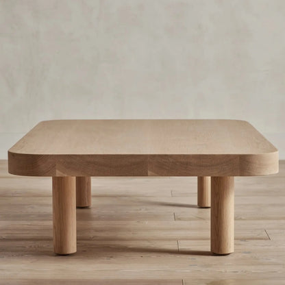 Contemporary Low Profile Coffee Table with rounded edges and sturdy cylindrical legs