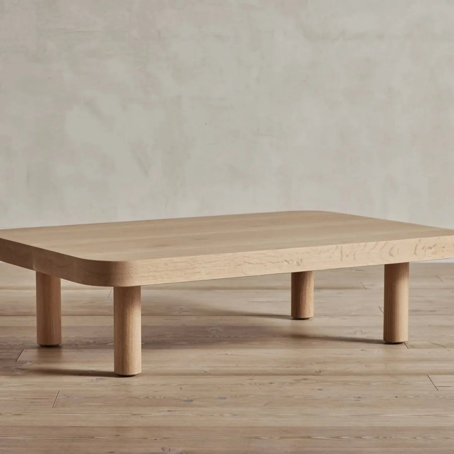 Contemporary Low Profile Coffee Table with rounded edges and sturdy cylindrical legs