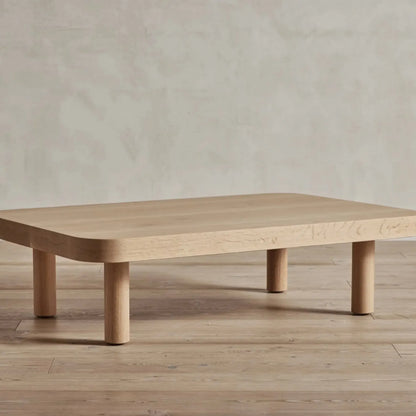 Contemporary Low Profile Coffee Table with rounded edges and sturdy cylindrical legs