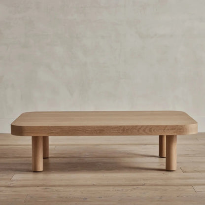 Contemporary Low Profile Coffee Table with rounded edges and sturdy cylindrical legs