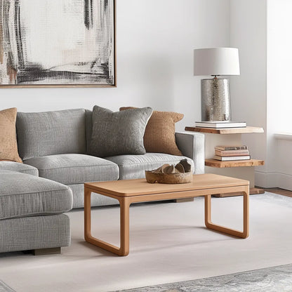 Contemporary rounded edge wooden coffee table in a modern living room.
