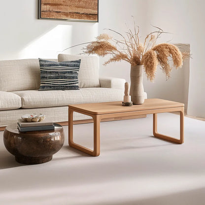 Contemporary rounded edge wooden coffee table in a modern living room.