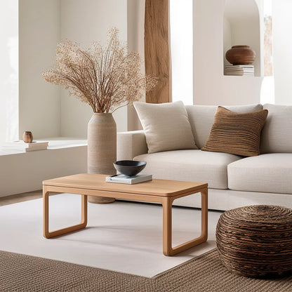 Contemporary rounded edge wooden coffee table in a modern living room.