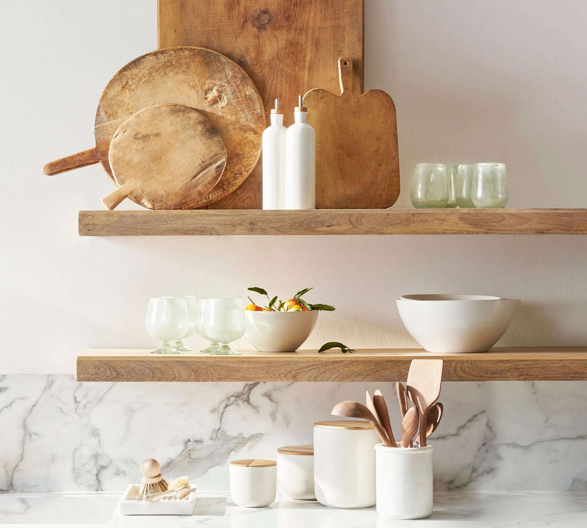 Contemporary wall mounted shelf styled with plants and decor items