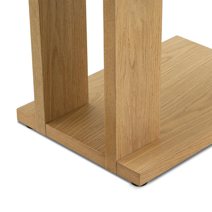Elegant C shaped side table with open base and compact design perfect for small spaces