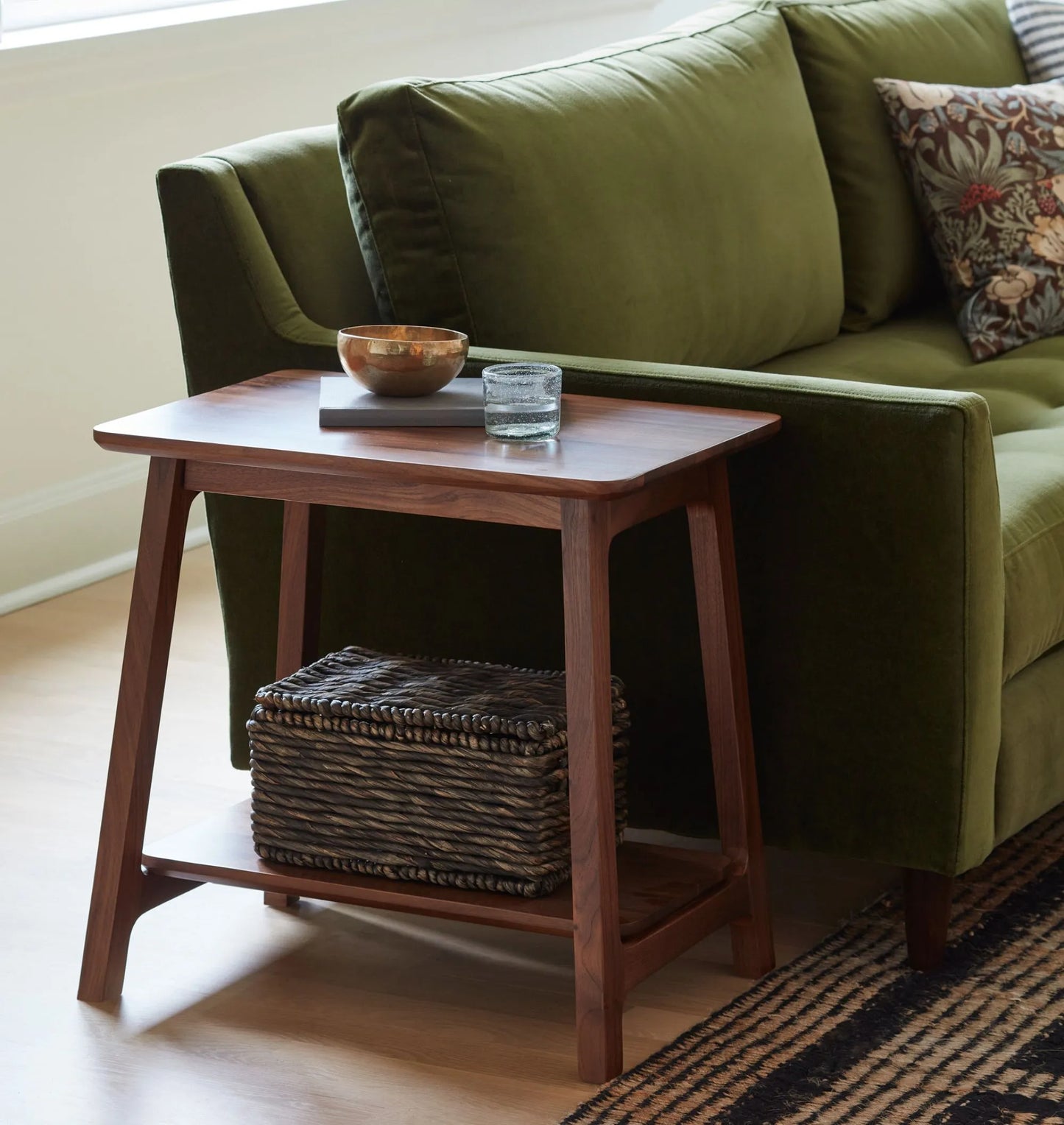 Elegant compact wooden side table with open lower shelf in a cozy room