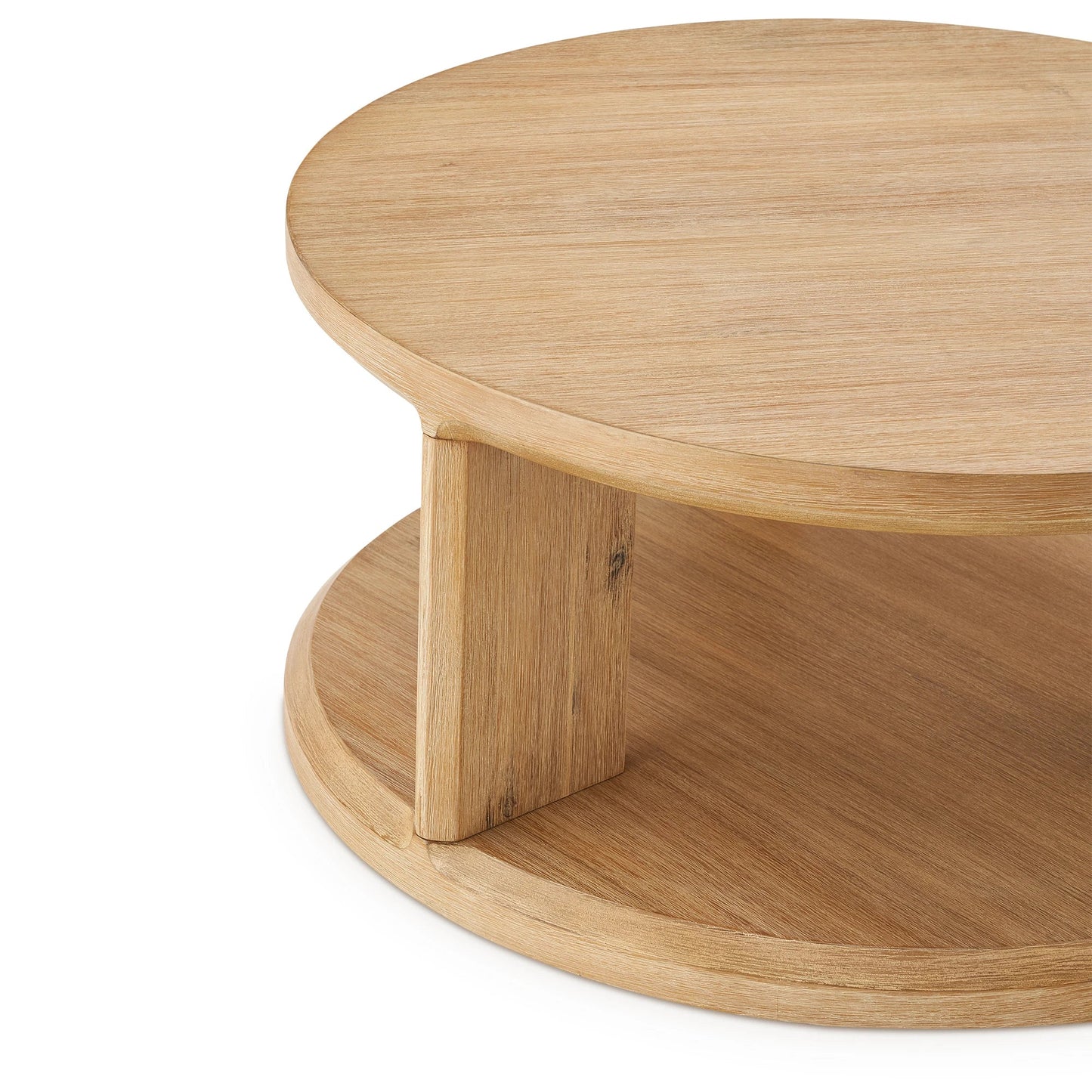 Elegant round coffee table with a spacious surface and open storage shelf
