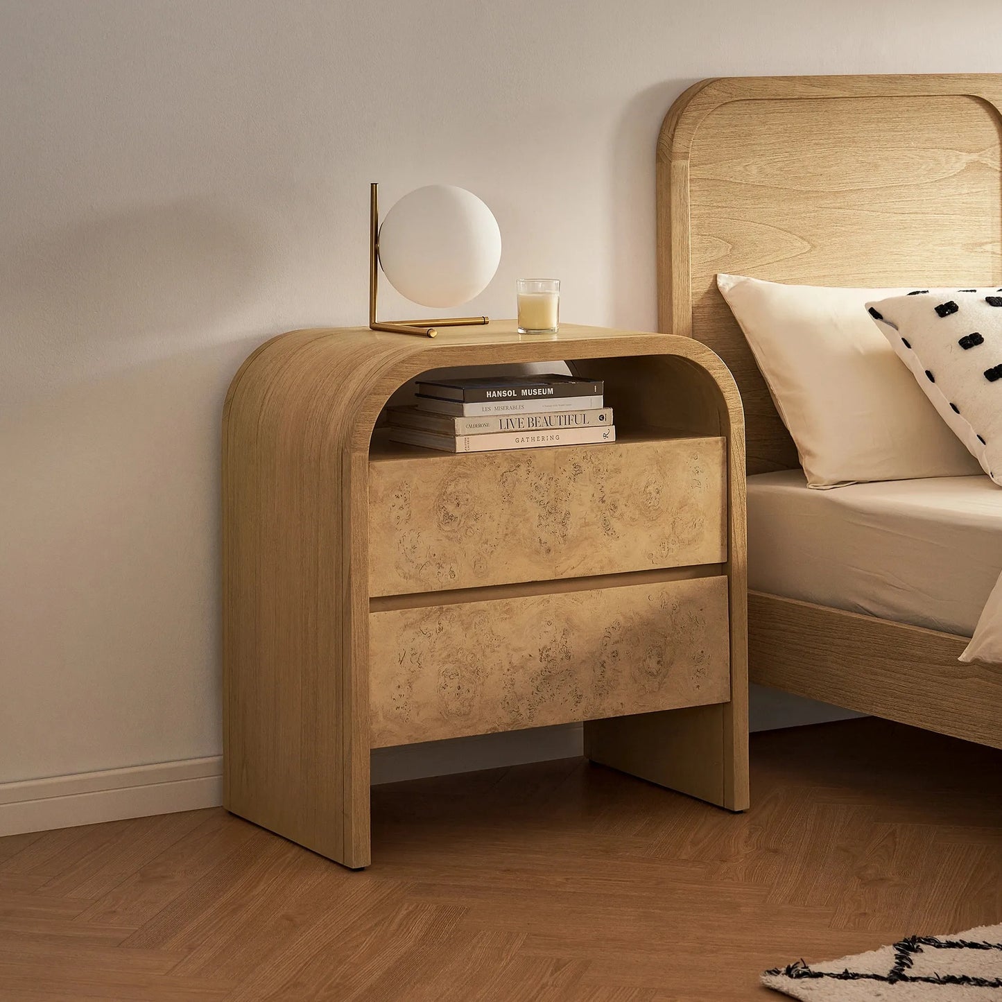 Elegant two drawer nightstand with a curved top and modern design perfect for contemporary bedrooms