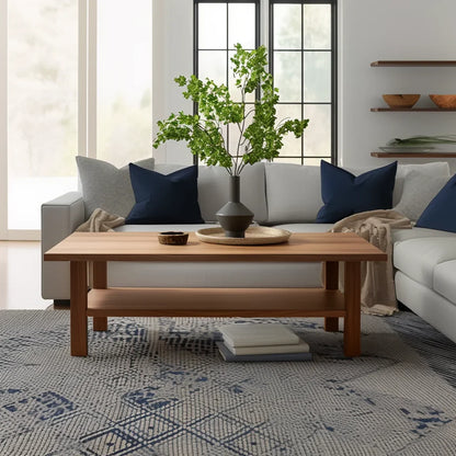 Essential coffee table with lower shelf in a modern living room with neutral tones