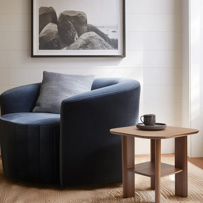 Everyday side table with square top and lower shelf styled in a cozy modern reading corner