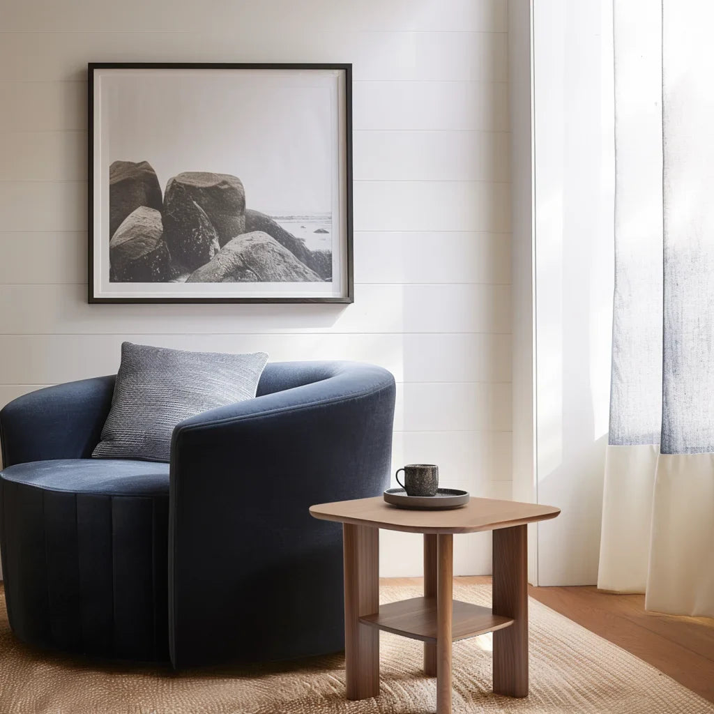 Everyday side table with square top and lower shelf styled in a cozy modern reading corner