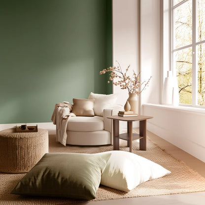 Everyday side table with square top and lower shelf styled in a cozy modern reading corner