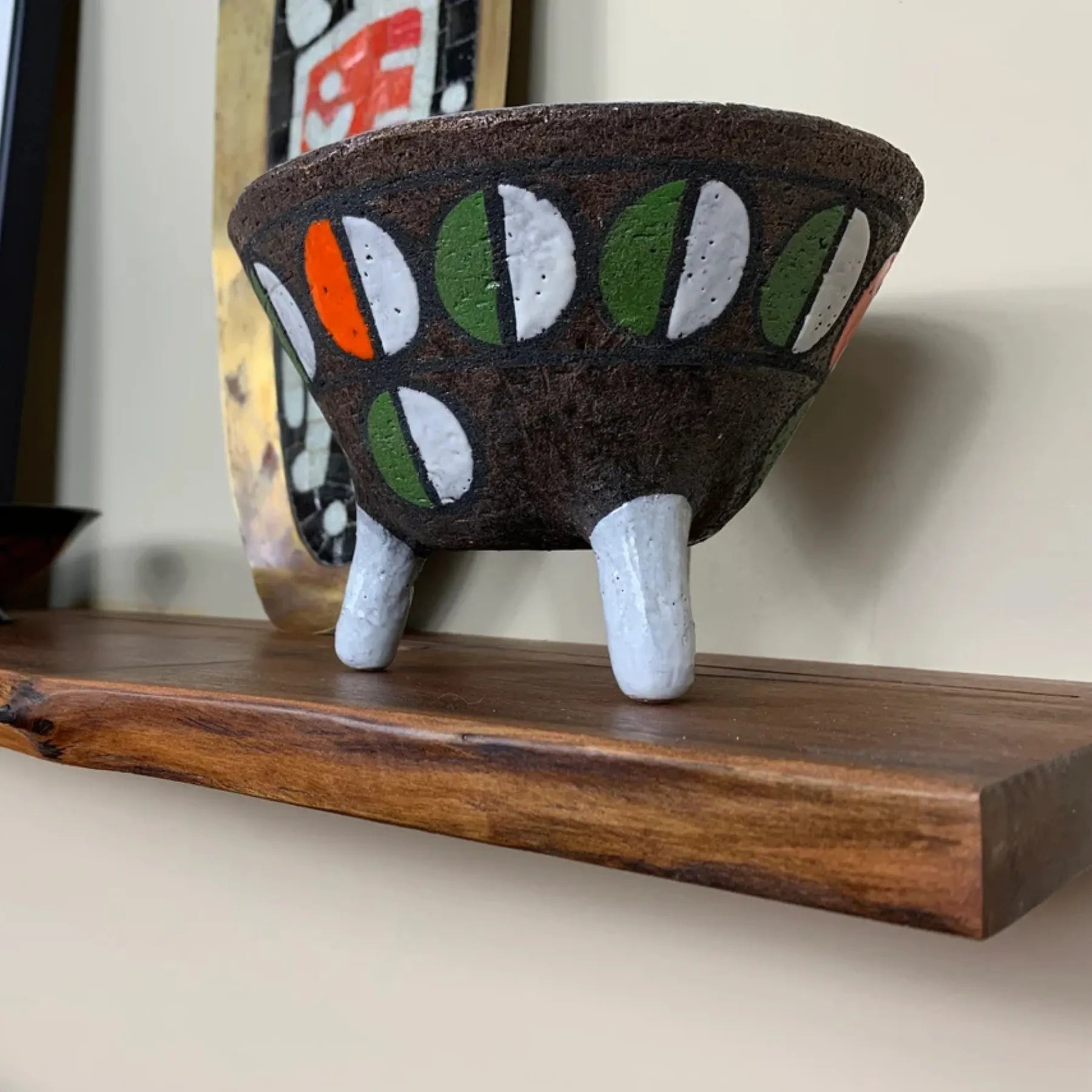 Floating Shelf Organic Edge mounted on a minimalist wall with plants and books