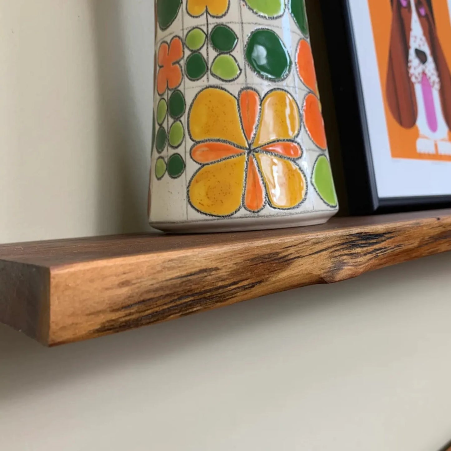 Floating Shelf Organic Edge mounted on a minimalist wall with plants and books