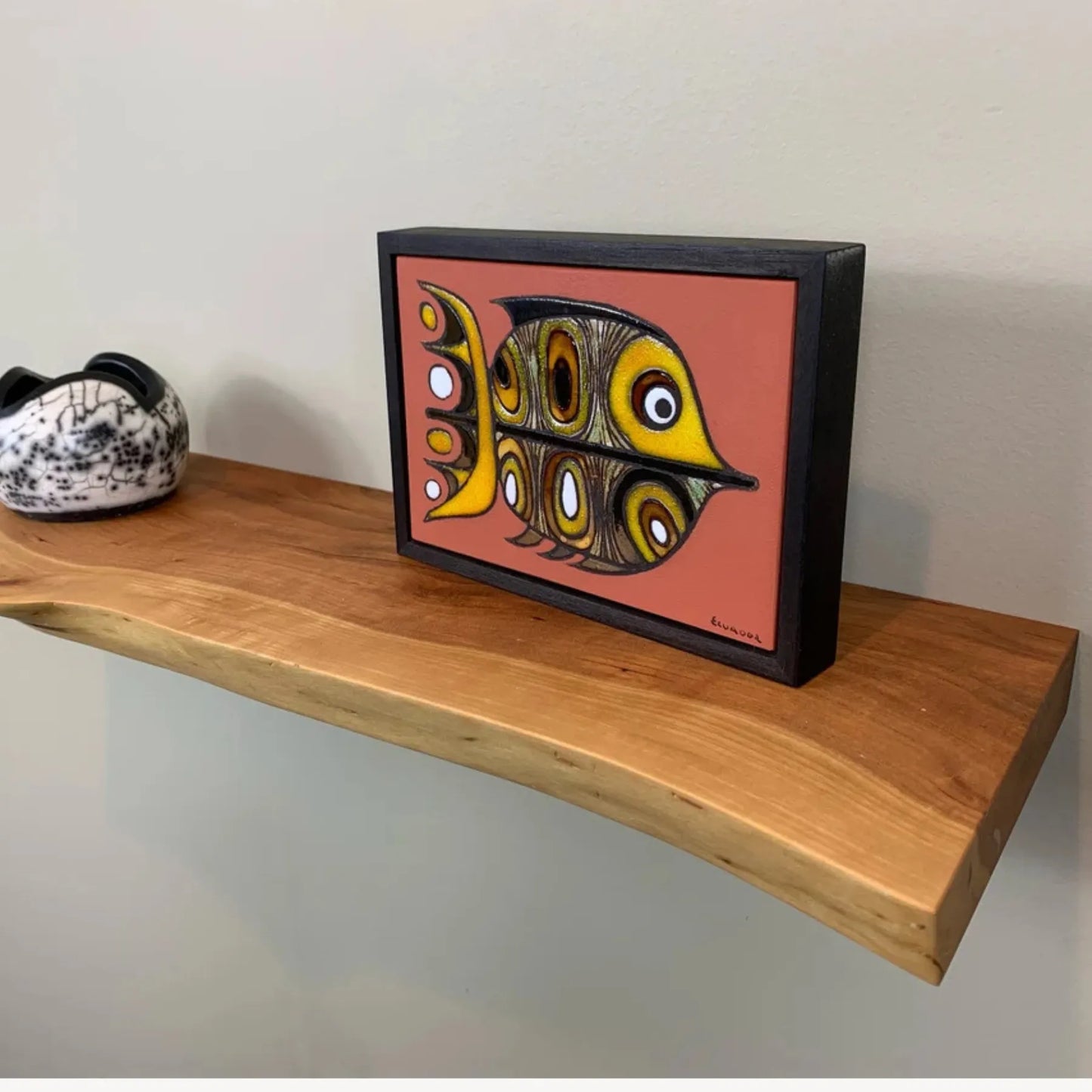 Floating Shelf Organic Edge mounted on a minimalist wall with plants and books