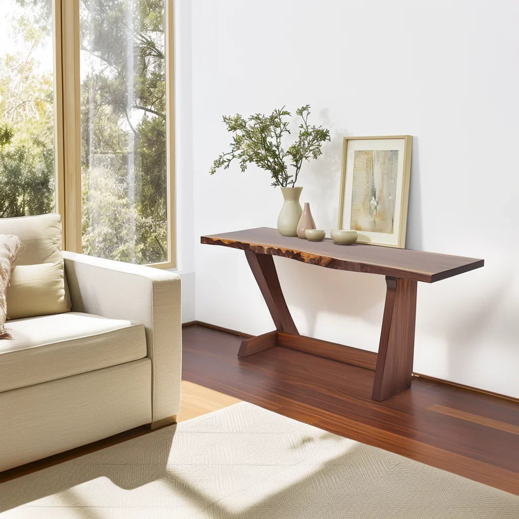 Live edge console table with angled legs styled in a sunlit modern living room