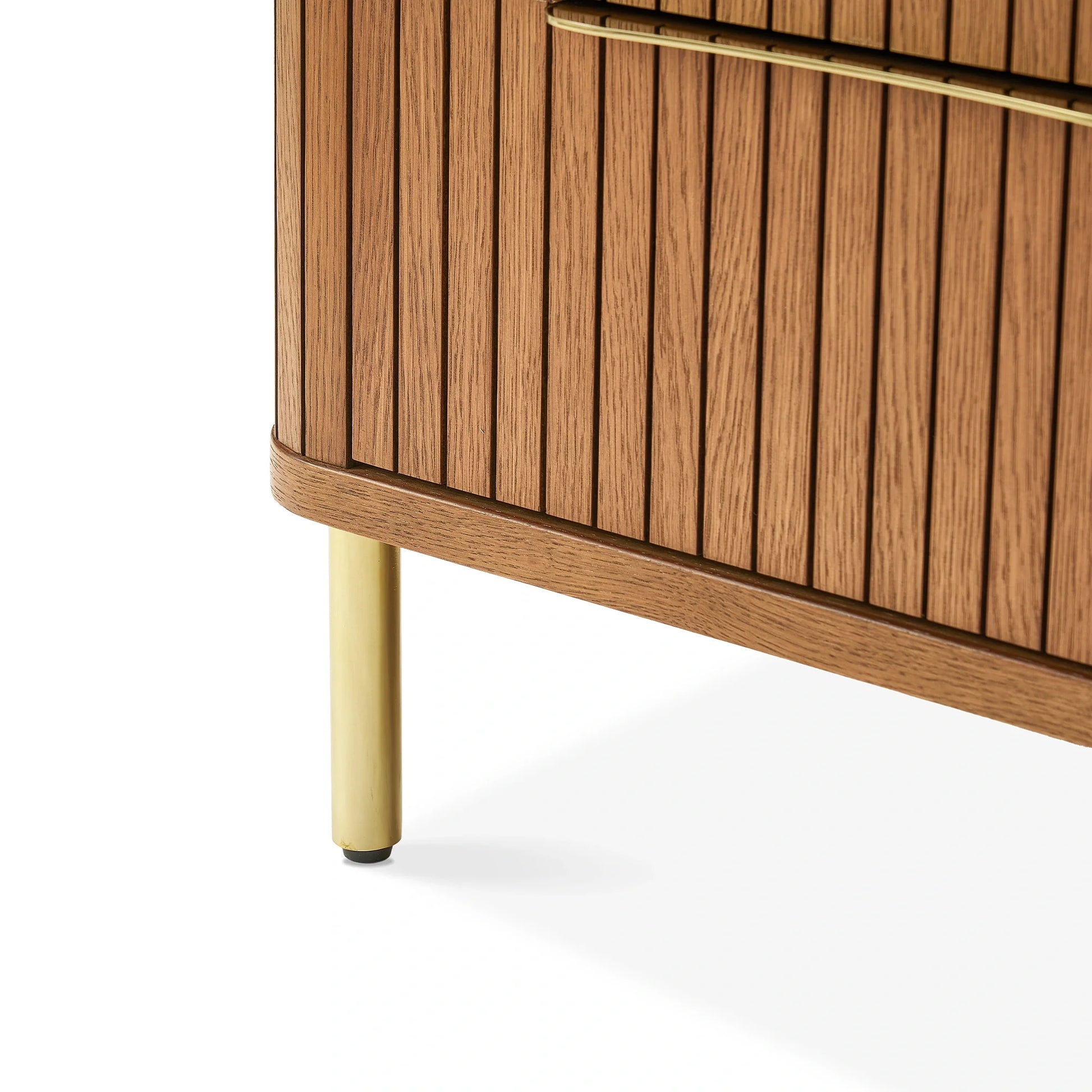 Luxury Nightstand with two drawers, vertical panel design, and gold metal legs in a modern bedroom setting