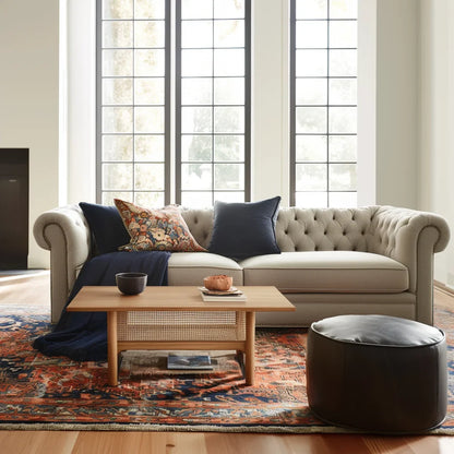 Mid century coffee table with woven shelf placed in cozy living room