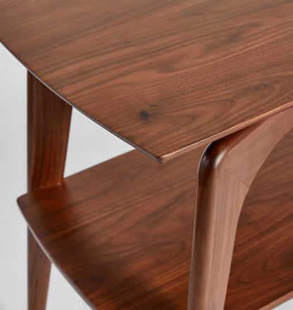 Mid century console table with curved edges, tapered legs, and two spacious shelves.