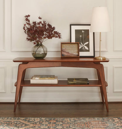Mid century console table with curved edges, tapered legs, and two spacious shelves.