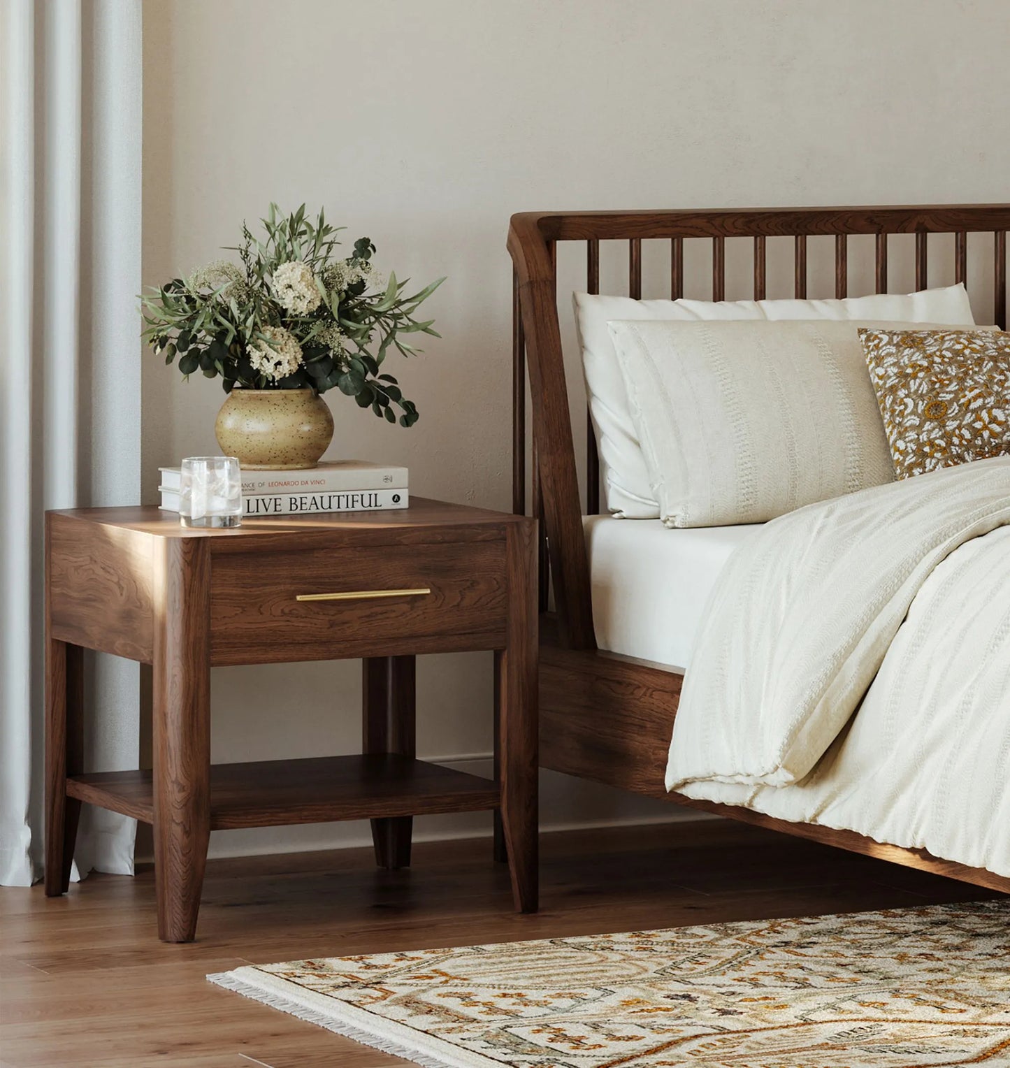 Mid century nightstand with single drawer, open shelf, and tapered legs.