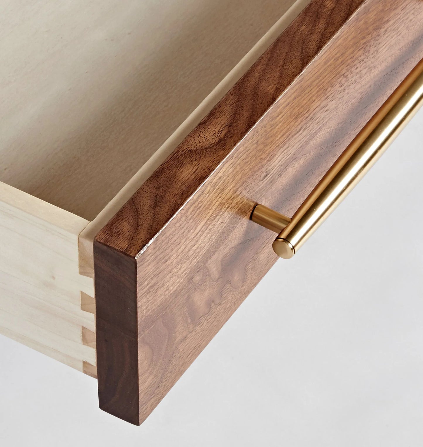 Mid century nightstand with single drawer, open shelf, and tapered legs.