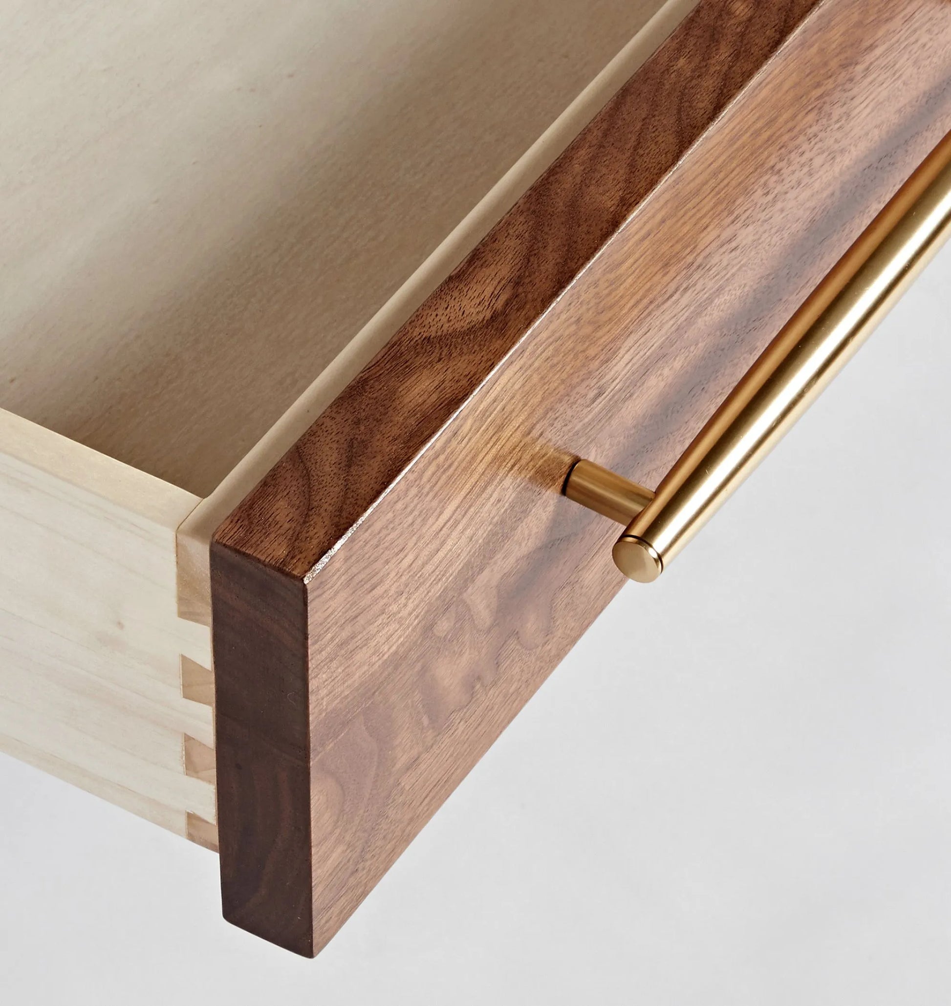 Mid century nightstand with single drawer, open shelf, and tapered legs.