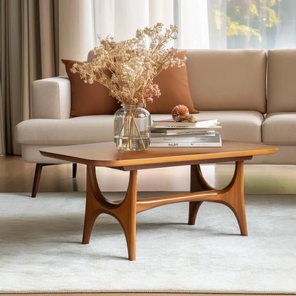 Midline coffee console centered in minimal lounge setting under warm filtered light