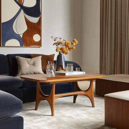 Midline coffee console centered in minimal lounge setting under warm filtered light