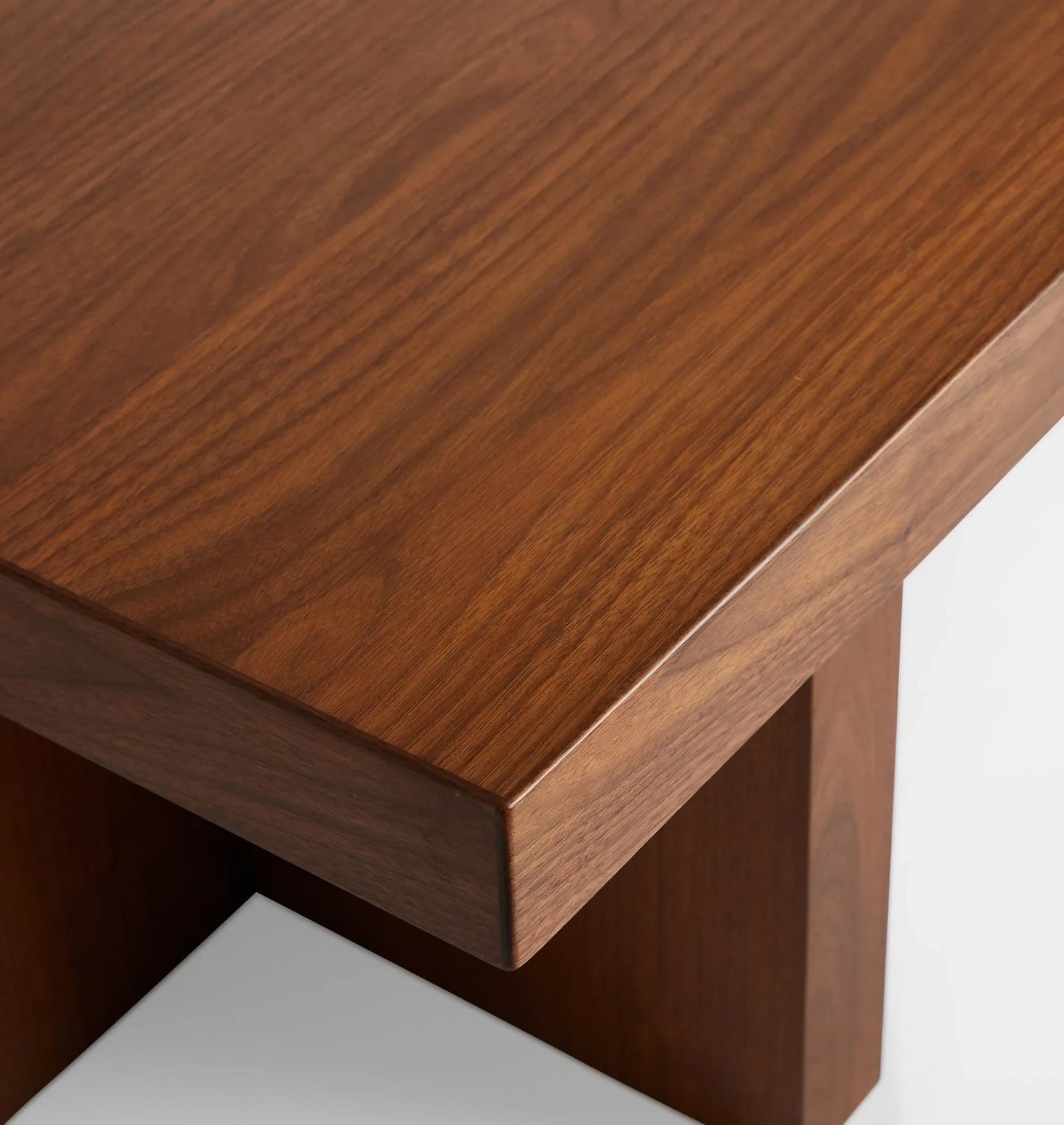 Minimalist coffee table featuring bold geometric design and smooth surface.