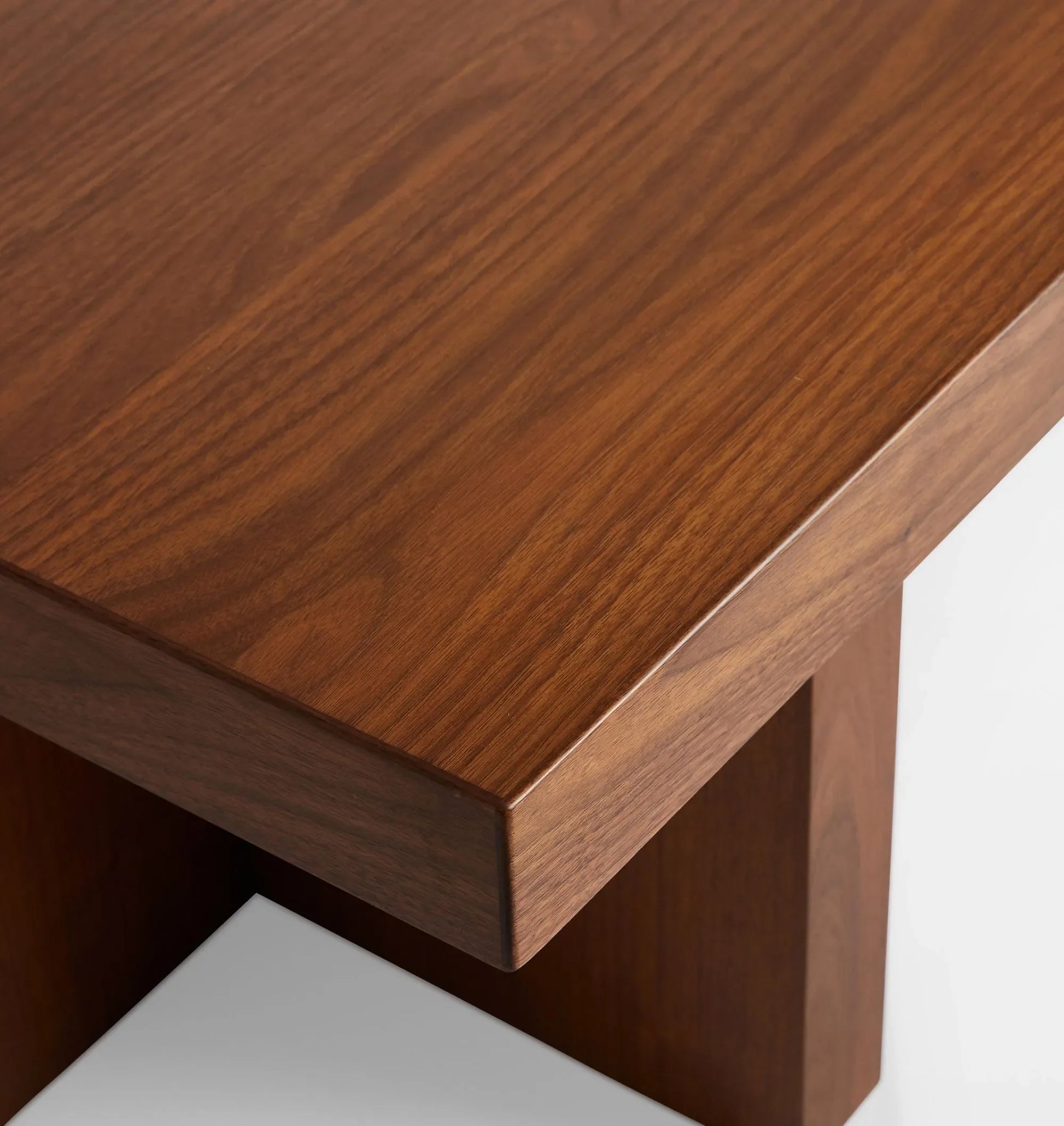 Minimalist coffee table featuring bold geometric design and smooth surface.