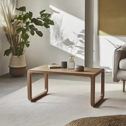 Modern curved wooden coffee table with minimalist style.