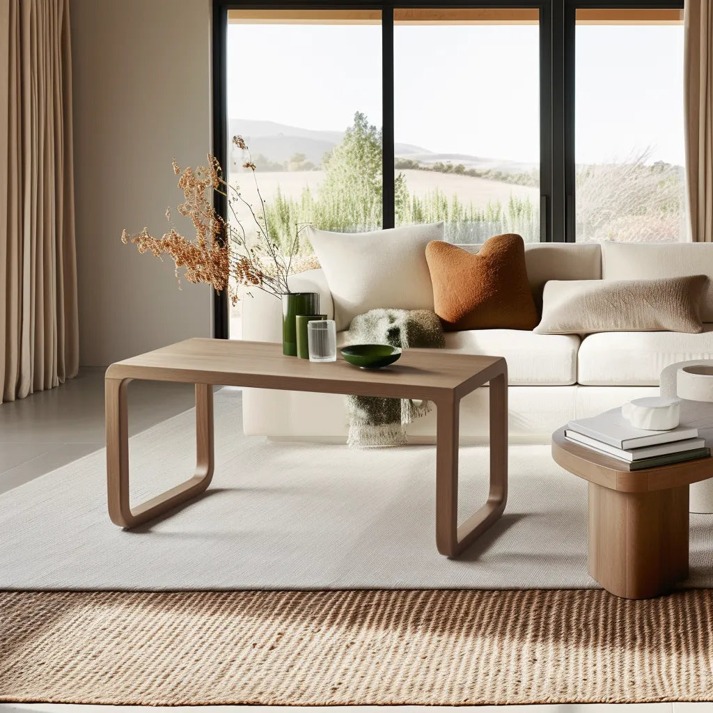 Modern curved wooden coffee table with minimalist style.