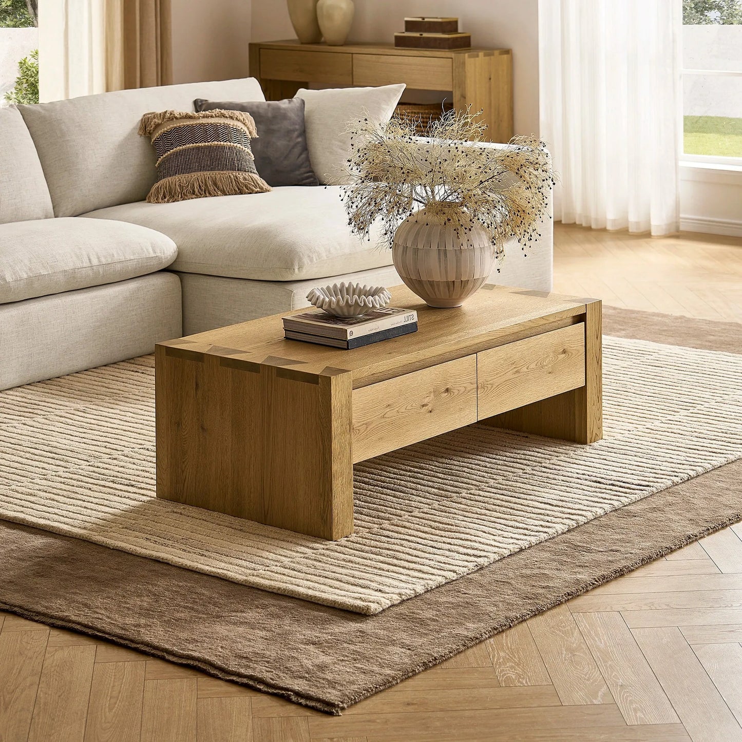 Stylish modern living room table with a spacious surface and hidden storage drawers for a clutter free space.