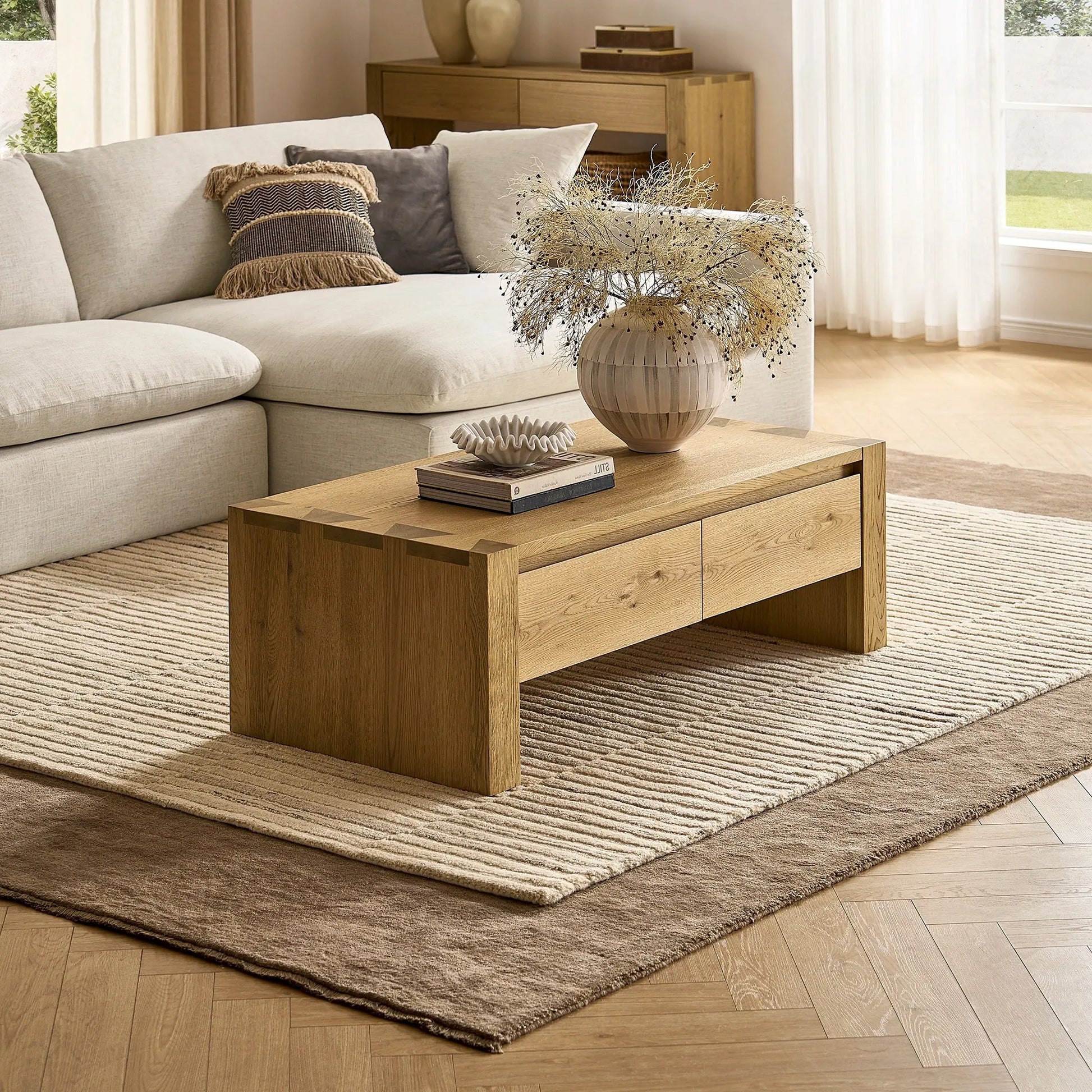 Stylish modern living room table with a spacious surface and hidden storage drawers for a clutter free space.
